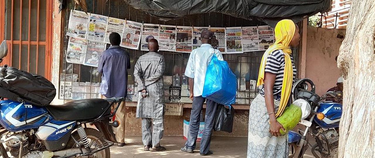 men reading newspapers
